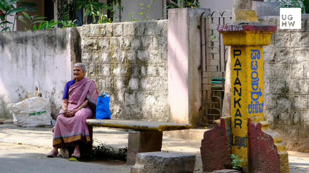 Women sitting in urban public space, representing safer cities and gender-responsive urban governance.