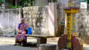 Women sitting in urban public space, representing safer cities and gender-responsive urban governance.