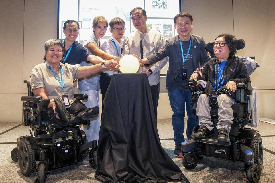 Government officials and wheelchair users at the launch of Singapore’s A11y Playground, an initiative supporting accessible and inclusive digital services.
