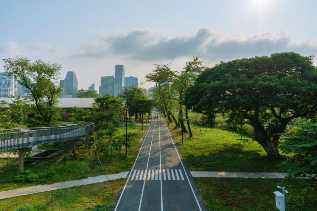Ground-level pedestrian path within Benjakitti Park designed to accommodate temporary water retention